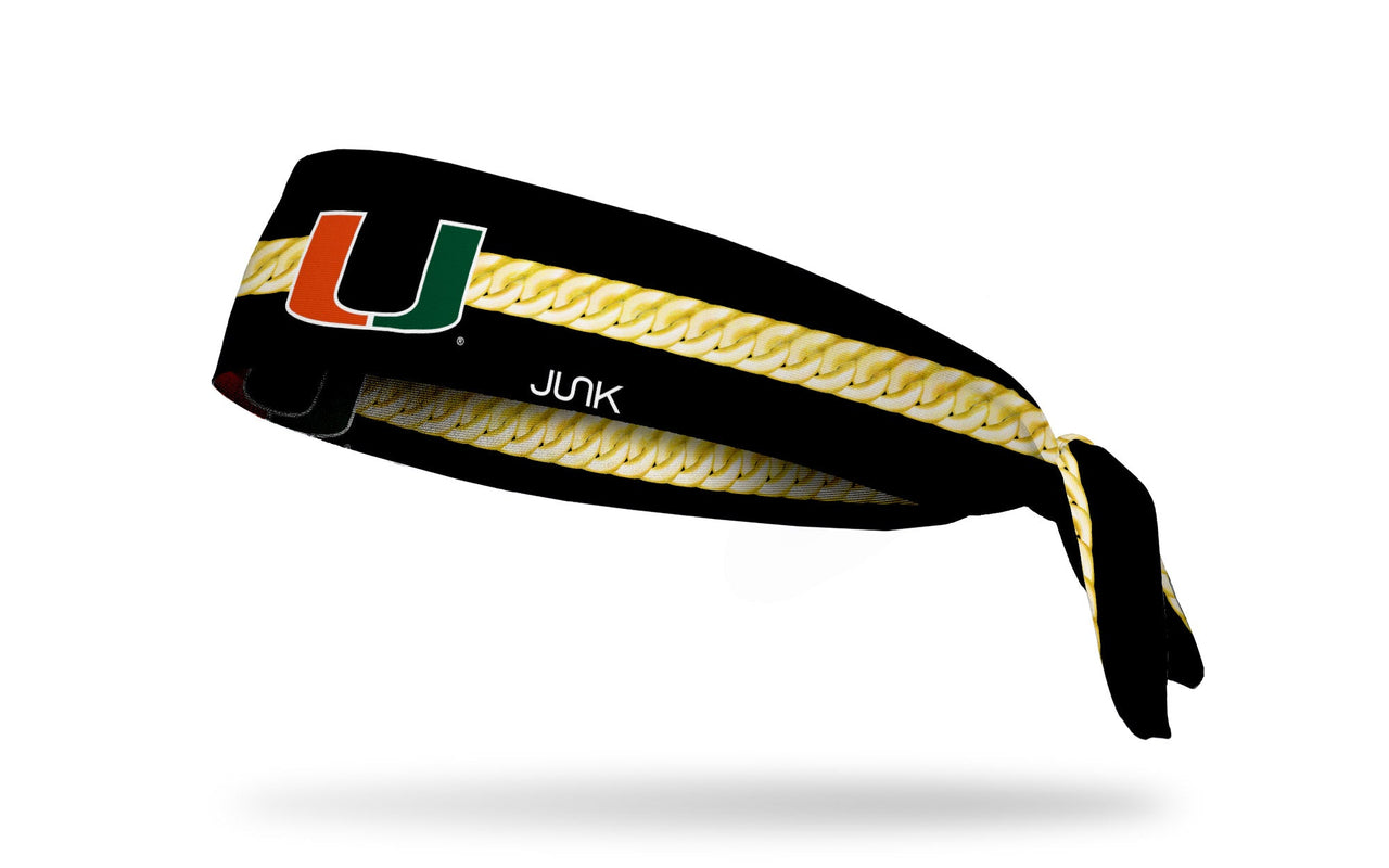 black headband with gold chain print around and University of Miami U in green and orange