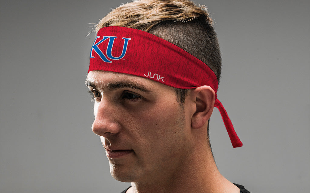 red heathered headband with University of Kansas K U logo in white and royal blue on male
