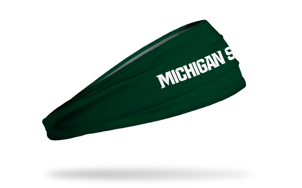 green headband with Michigan State University "Michigan State" wordmark in white